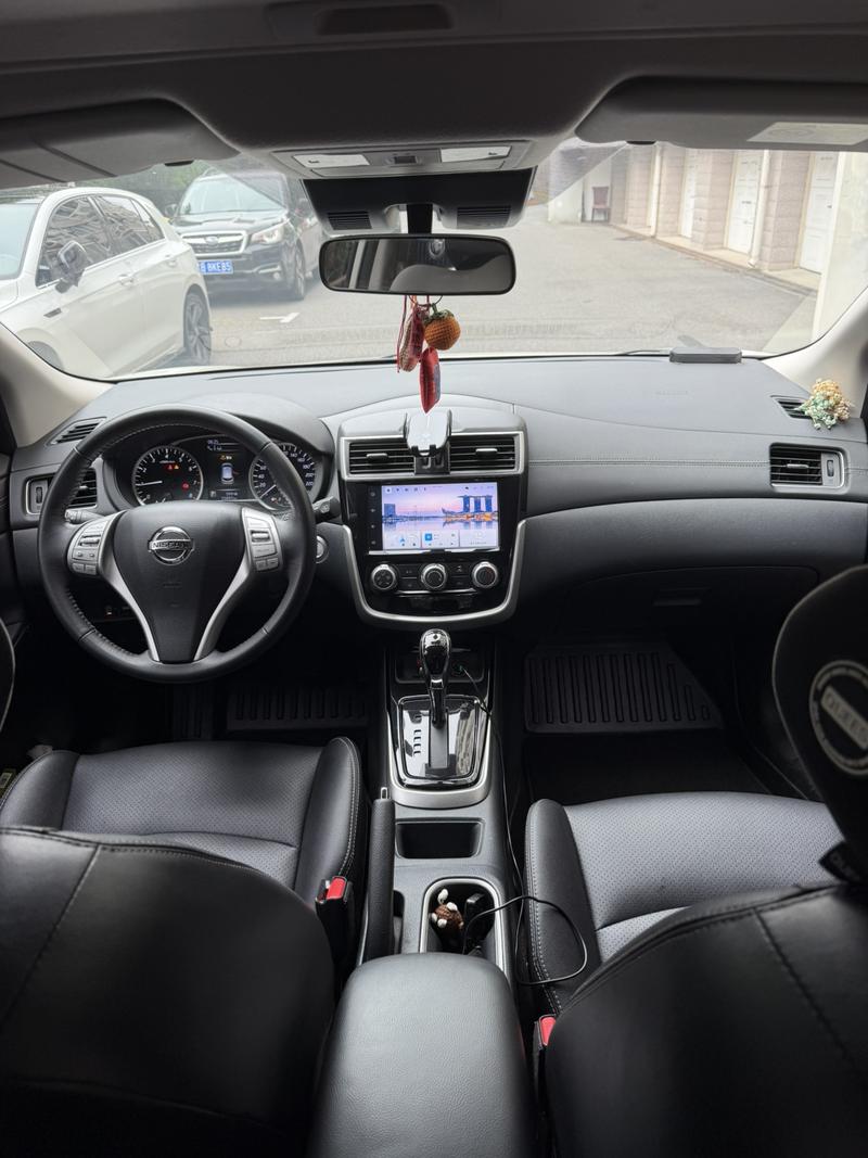 Nissan Tiida - фото 4