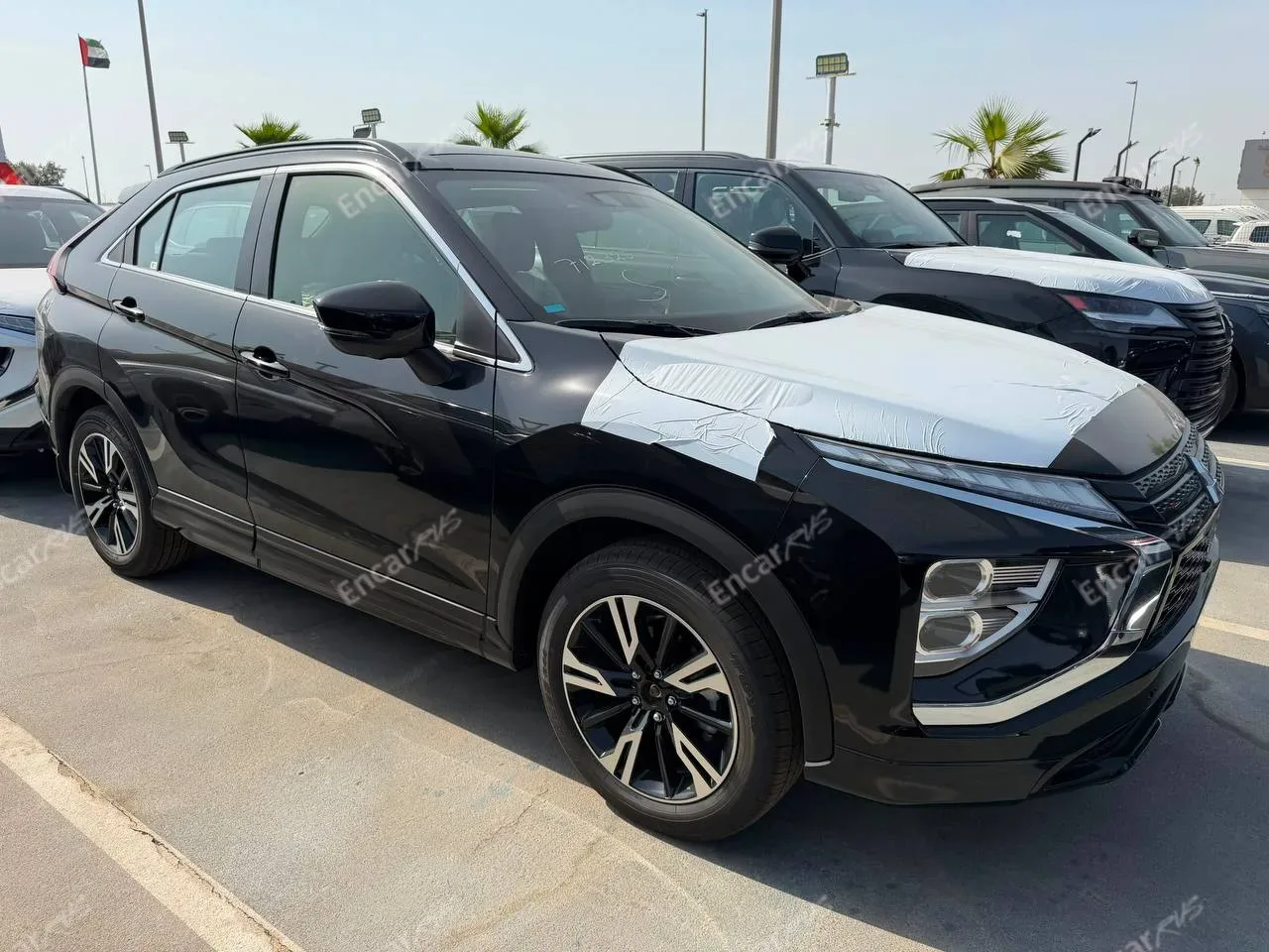 Mitsubishi Eclipse Cross 2026 чёрный — вид спереди три четверти